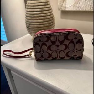 Coach Wristlet with pink leather trim and detachable leather strap